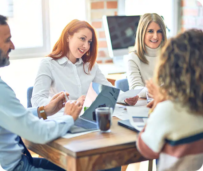 People sitting around a table in a meeting