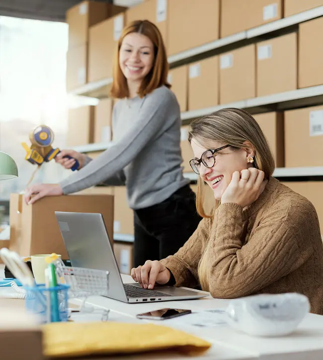 Two women smiling at work