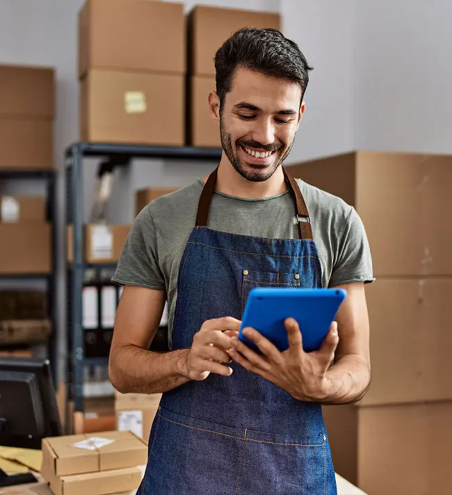 A man smiling while he works